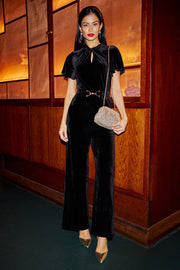 Yumi Black Velvet Jumpsuit With Twist Neckline And Buckle Belt